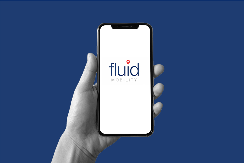 photo of a hand holding a phone with Fluid Mobility Logo on it