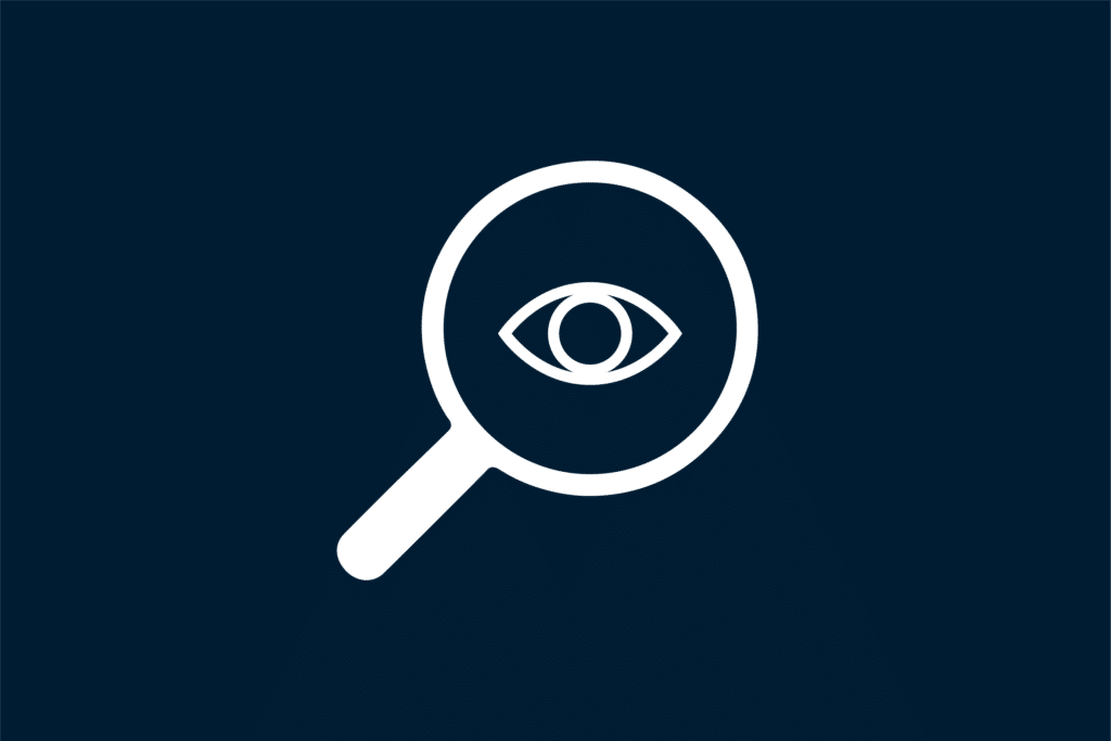 Magnifying glass with eye in the middle Icon